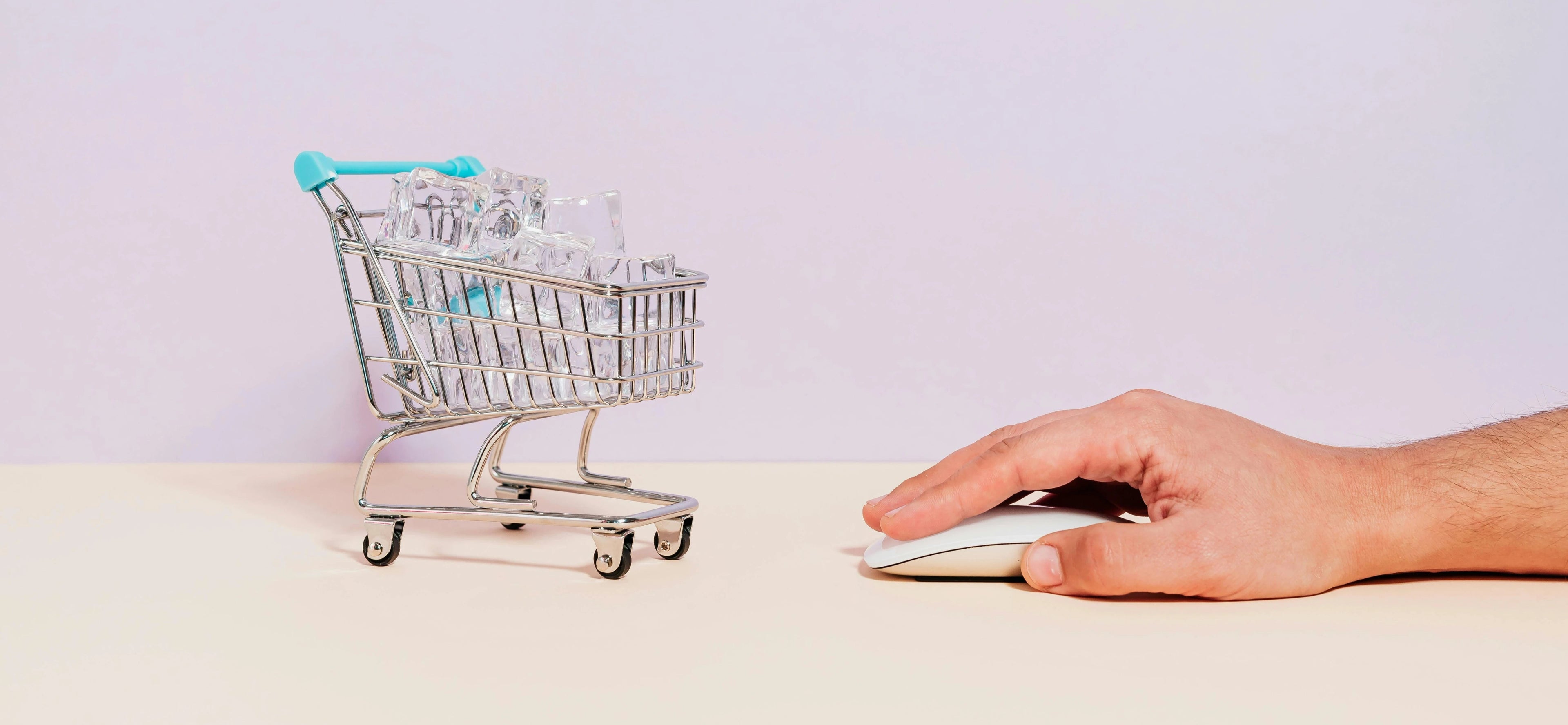 A trolley cart and a computer mouse with a hand on it